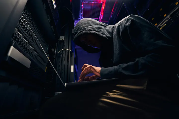 A hacker sitting at a computer