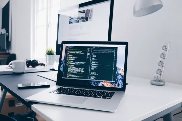 An Apple laptop on a desk