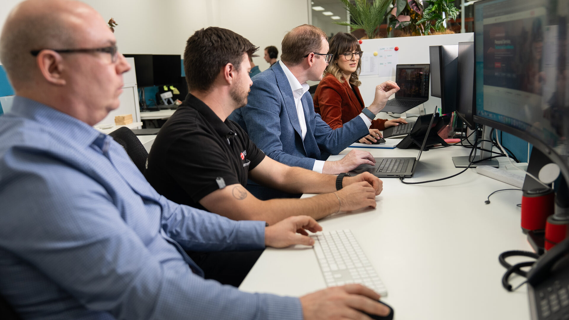 Real World engineers focused at their NOC workstations