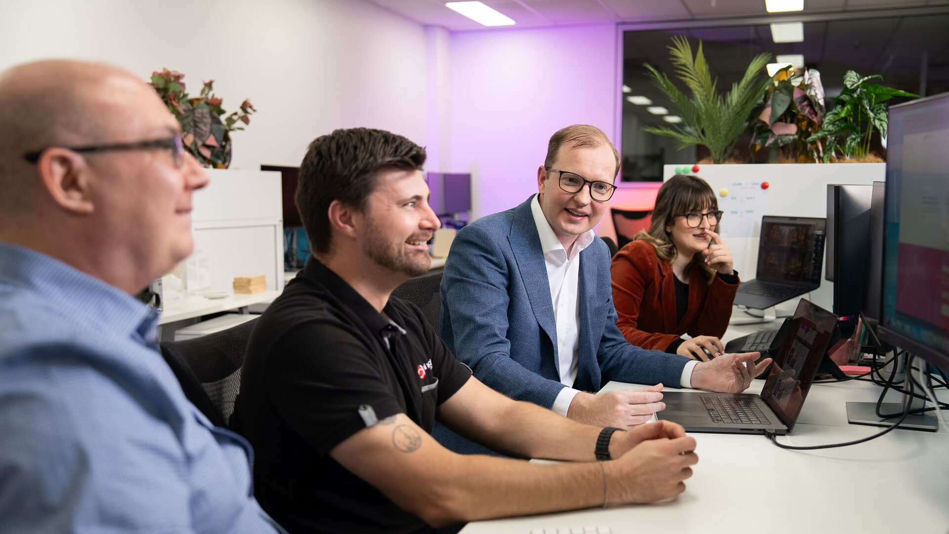 Real World Technology Solutions team collaborating at the office